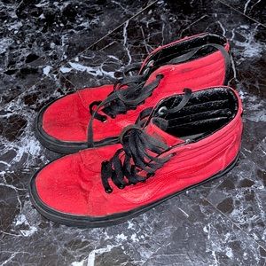 All black and red vans high stop